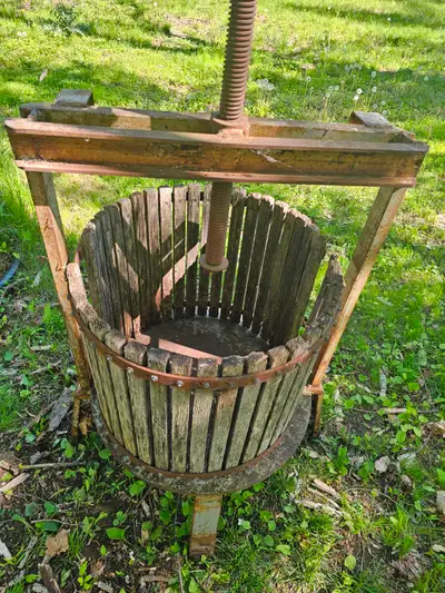Old antique grape press and horse plow that would make great lawn ornaments The metal parts are good...