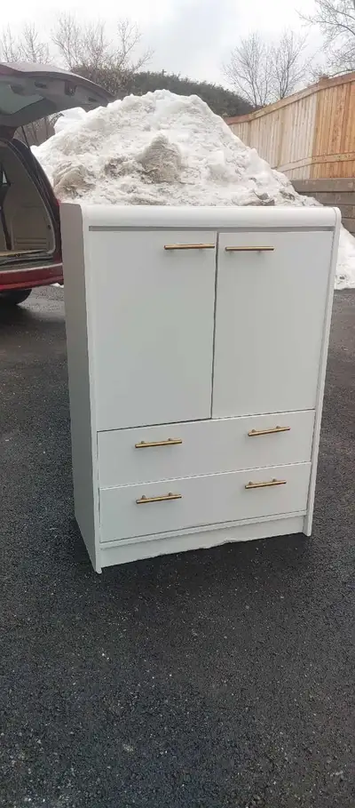 This white cabinet dresser offers a blend of storage and style! Featuring both cabinet space with sh...