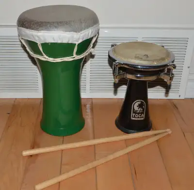 DRUMS PERCUSSION __ both drums with sticks sold as one lot __ Located near 96 St. and 76 Ave. __ PIC...