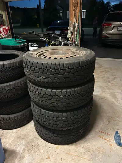 4 Cooper Evolution 235 65 17 Winter Tires on 17 inch steel rims. Tires are evenly worn with no cambe...