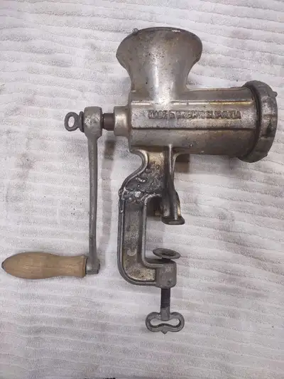 This is a vintage Porkert #8 meat grinder, made in Czechoslovakia. It's a sturdy, hand-cranked mince...