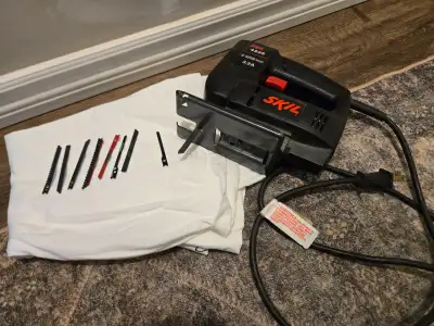 Handheld Skil jig saw with extra blades, View more