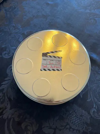 I'm offering a DHL film tin, complete with a set of CDs. This unique collectible includes a metal fi...