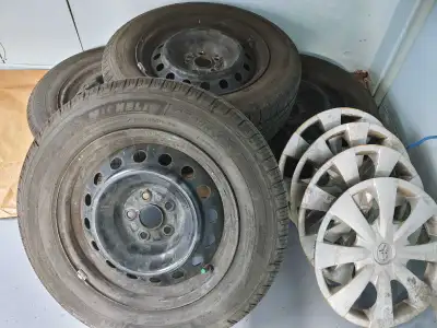 4 Toyota OEM steel rims for Corolla 4 Michelin X-TOUR all season tires 195/65/R15 (91H) used 1 seaso...