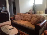Sofa, two end, tables, lamp, and area rug