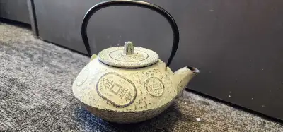 A Japanese Nambu Tekki cast iron teapot with "Tenpō Tsūhō" coin , View more