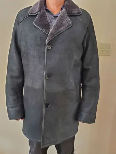 Sheepskin man coat. Very warm, good for very cold temperature. Used but very good condition. Size XL...