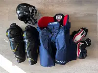 Hockey pants, shin pads, elbow pads, and helmet w/ cage