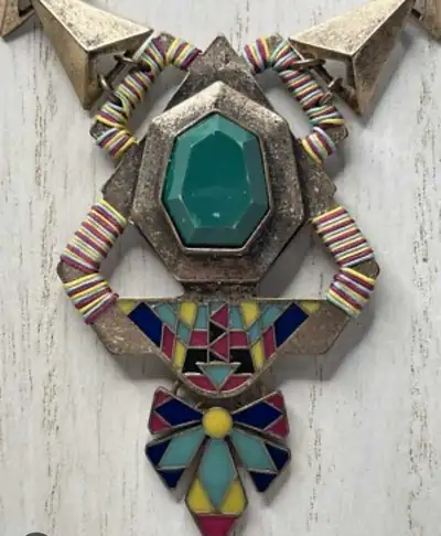 This is a native style choker necklace with a large green stone and colourful beading, perfect for a...