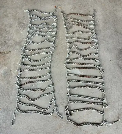 We have a pair of John Deere tire chains to improve traction not just in snow or ice but also in mud...