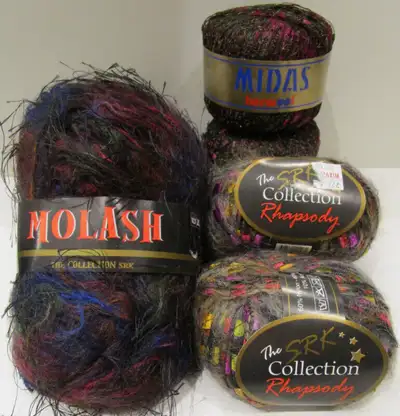 PRICE IS FIRM AND WILL NOT BE LOWERED. Two balls of SRK "Molash", black with fuchsia and blue, made...