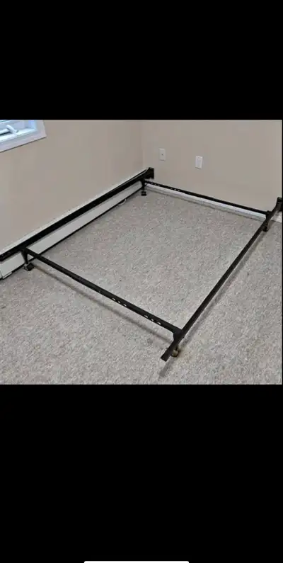 This metal queen-size bed frame is in good condition and ready to support your mattress! It's sturdy...