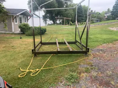 DockRite 2000lb capacity lift. 98" inside beam 24" of leg adjustment on all 4 legs Manual winch Cano...