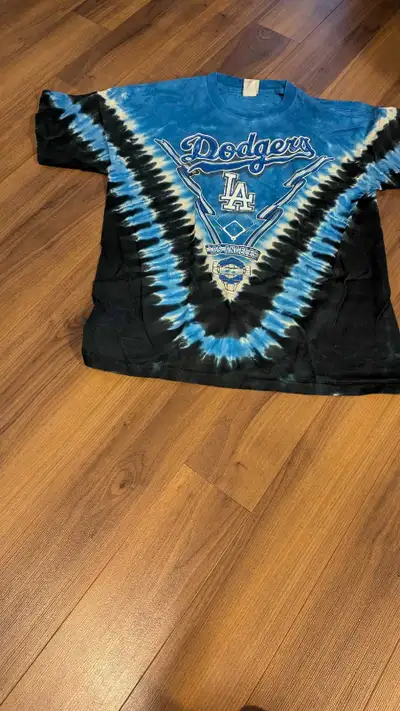 Vintage Los Angeles Dodgers T-Shirt with a unique tie-dye design, perfect for any baseball fan. This...