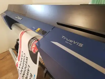 Large format printer. Prints on canvas, banner material, vinyl. Die cuts to any shape. Can throw a m...