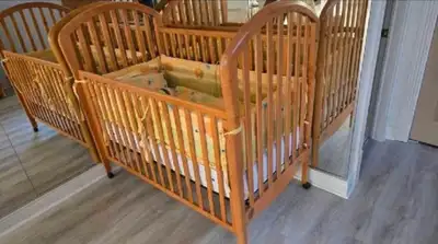 Barely used solid wood crib.