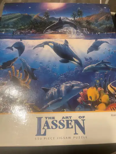 This is a brand new, never opened 550-piece jigsaw puzzle featuring the art of Lassen, perfect for p...
