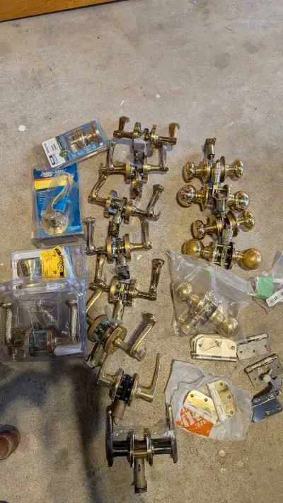 Selling a lot of used door knobs in various styles and finishes, perfect for updating your home's ha...