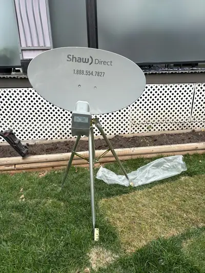 Description: Shaw Direct satellite dish with tripod stand included. In good condition and no longer...