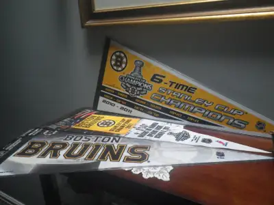 I HAVE THREE NEW BOSTON BRUINS PENNANTS FOR SALE. SELLING AS A LOT OF THREE PENNANTS. 30” X 12”. I W...