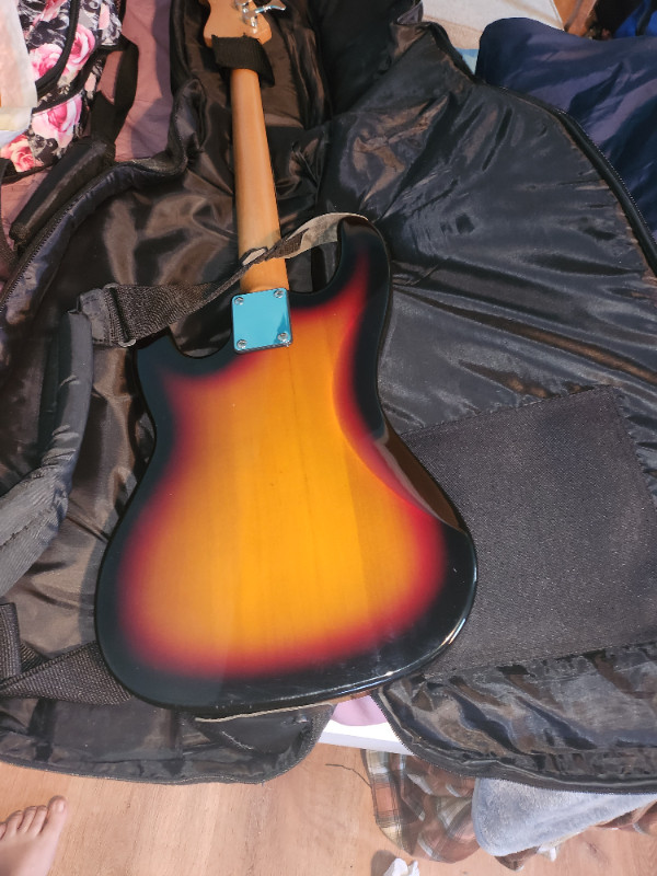Electric Bass Guitar with carry case, auto tuner and books in Guitars in Belleville - Image 3