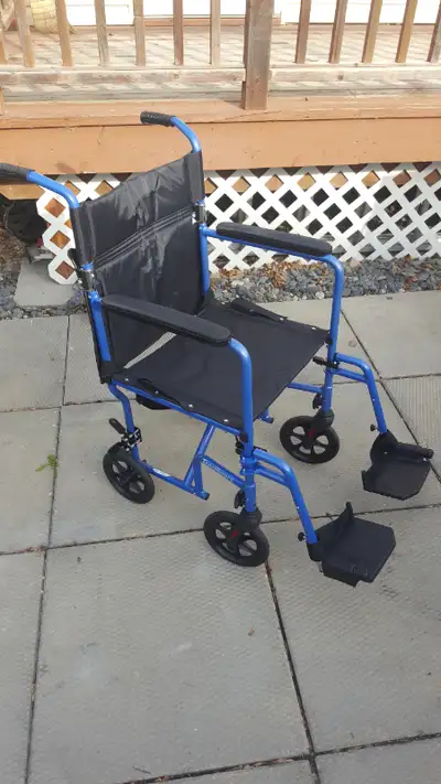 Like new, hardly used. Foldable, Lightweight Transport Wheelchair with Storage Pouch & foot rests Br...