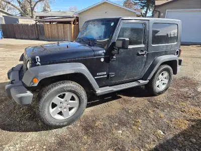 Get ready for summer with a new to you Jeep! - 2 door removable hard top - 3.8 L V-6 with rare 6 spd...