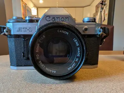 Canon AT-1 35 mm film camera and lenses, View more
