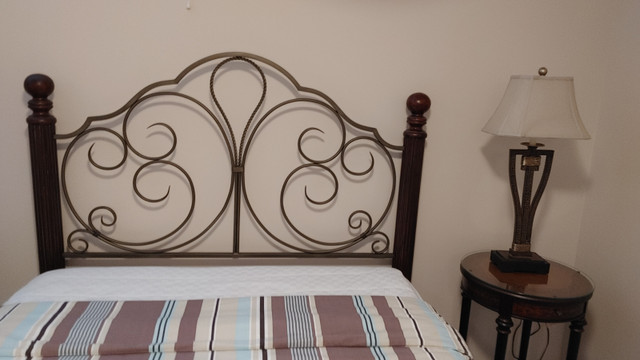Queen size bed, bent metal head board. Barely used. in Beds & Mattresses in Ottawa