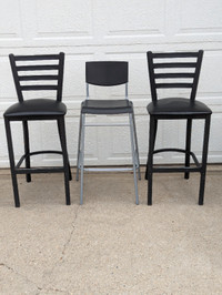 Black-seated, metal-legged, 29-inch high counter stools