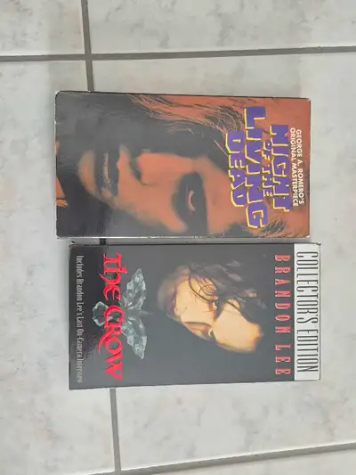 Selling two classic VHS movies. The first is George A. Romero's 'Night of the Living Dead', a horror...