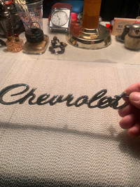 VINTAGE FANCY SCRIPT CHEVROLET METAL EMBLEM