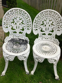 2 cast iron garden chairs