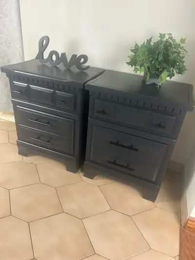 These are a pair of pine refinished nightstands with two drawers each, perfect for adding storage an...