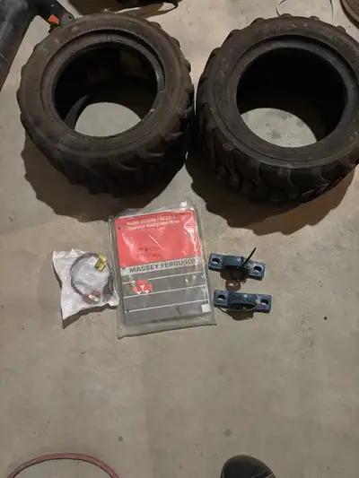 Two spare front tires. Ignition with two keys. A block heater, owners manual, and front control arm...