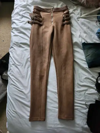 Tan pants with buckles and zipper, View more