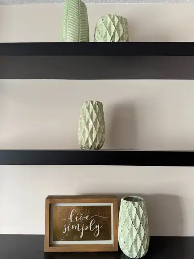 Four decorative vases, two styles. Pale green colour. Perfect for home decor. Modern style.
