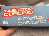 TABLE TOP CURLING GAME THAT IS COMPLETE, ALL PIECES ARE IN NEAR