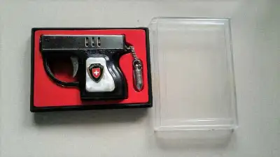 Collectible Vintage LAUREL Mini Pistol Hand Gun Lighter with case. It has pearl handles with Switzer...