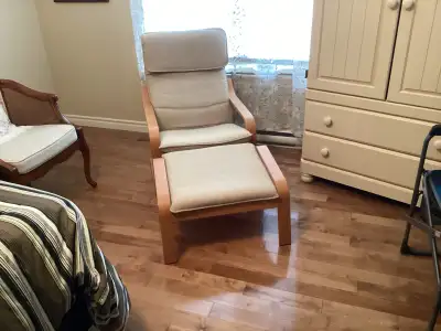 This is a used Ikea chair and ottoman set, perfect for adding a touch of comfort to any room. The cu...