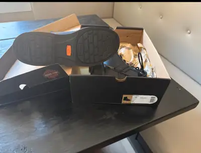 New, still in the Box. Steel-toe work boots size 11