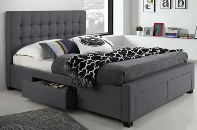 This stylish queen bedframe features a modern design with a tufted headboard and convenient built-in...