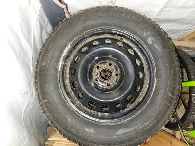 Set of 4 Michelin x-ice tires 215/65R16 on rims from a 2016 chevy trax. (5x105) They will also fit a...