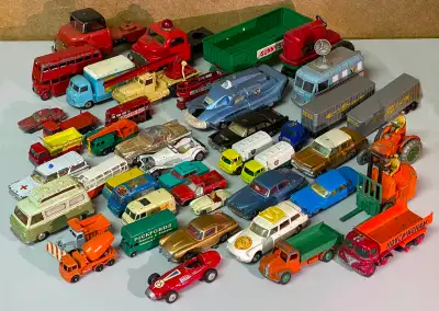 Lesney, Dinky, Corgi and some without names. Well loved toys - some missing paint, tires etc. Includ...