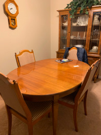 Wood dining set..table with extension, 4 chairs and a hutch