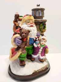 Santa Claus Carrying Toy Sack & Cove Light House 10" Tall 