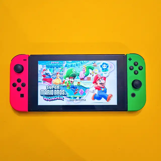 Nintendo Switch Pink/Green with Case in Nintendo Switch in Edmonton - Image 2