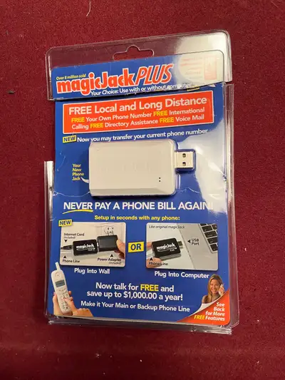 Magic Jack PLUS In perfect condition with original packaging.