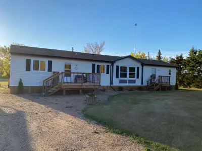 Beautiful acreage with manufactured modular home and oversized double detached garage Just over 3 ac...