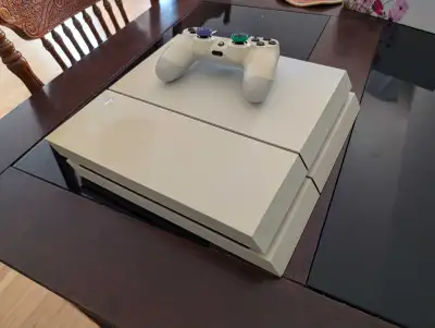 Selling a perfectly working PS4 with 1 controller and a mod dongle with GoldHEN loaded. Condition: p...